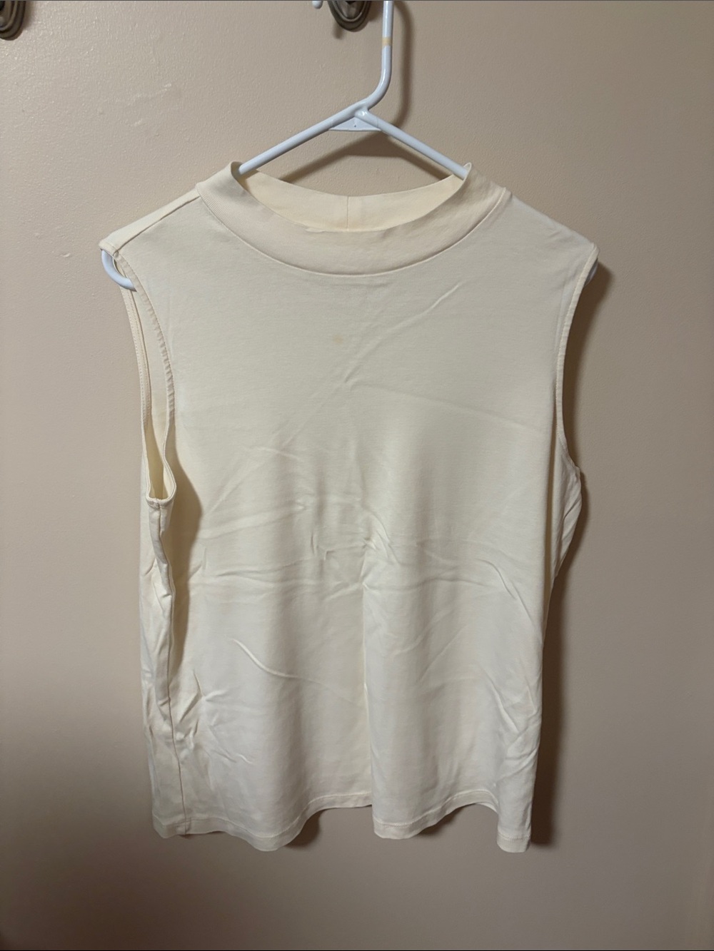 Sleeveless mockneck
